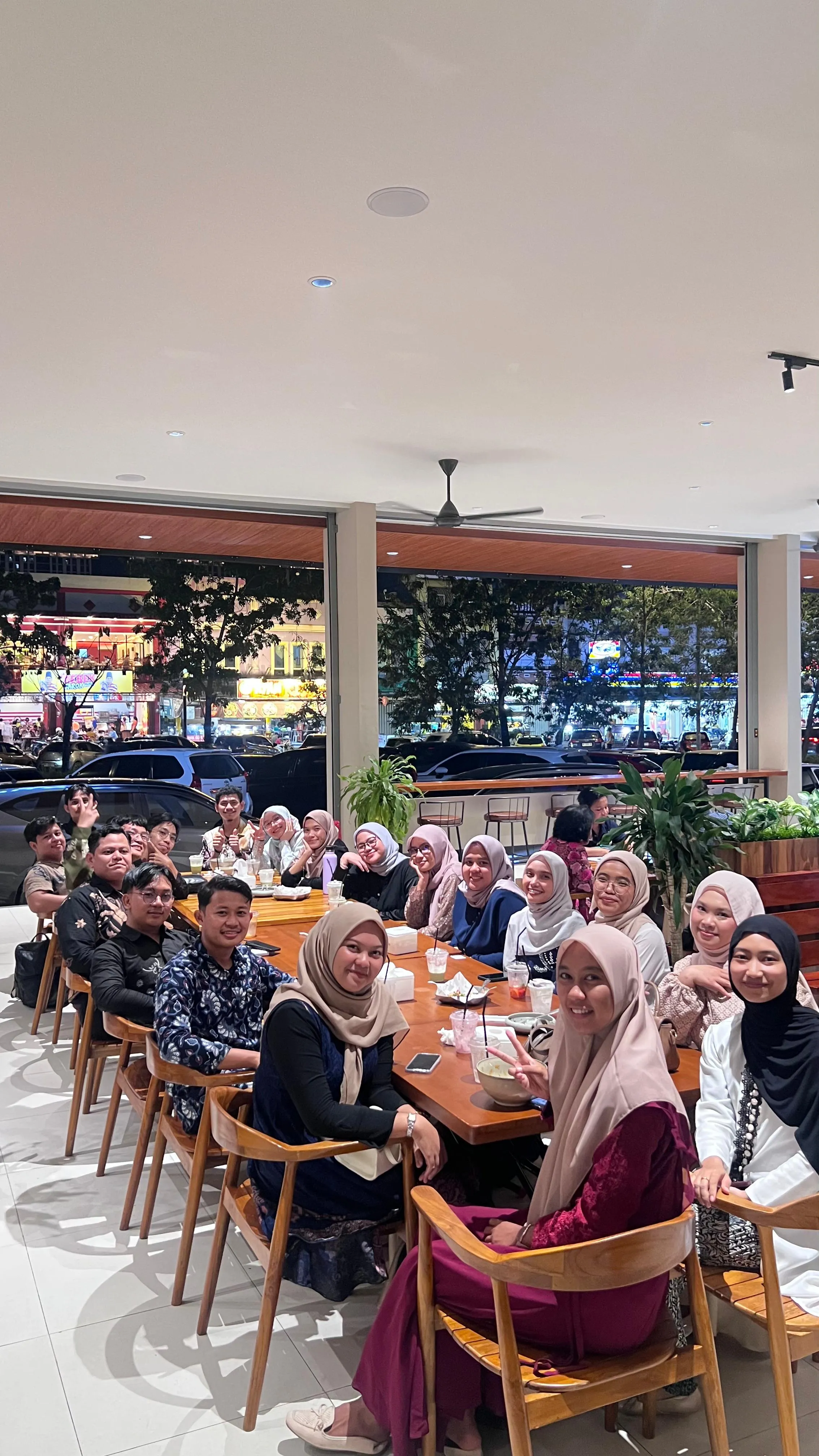 Friends gathering and reconnecting over dinner in Batam
